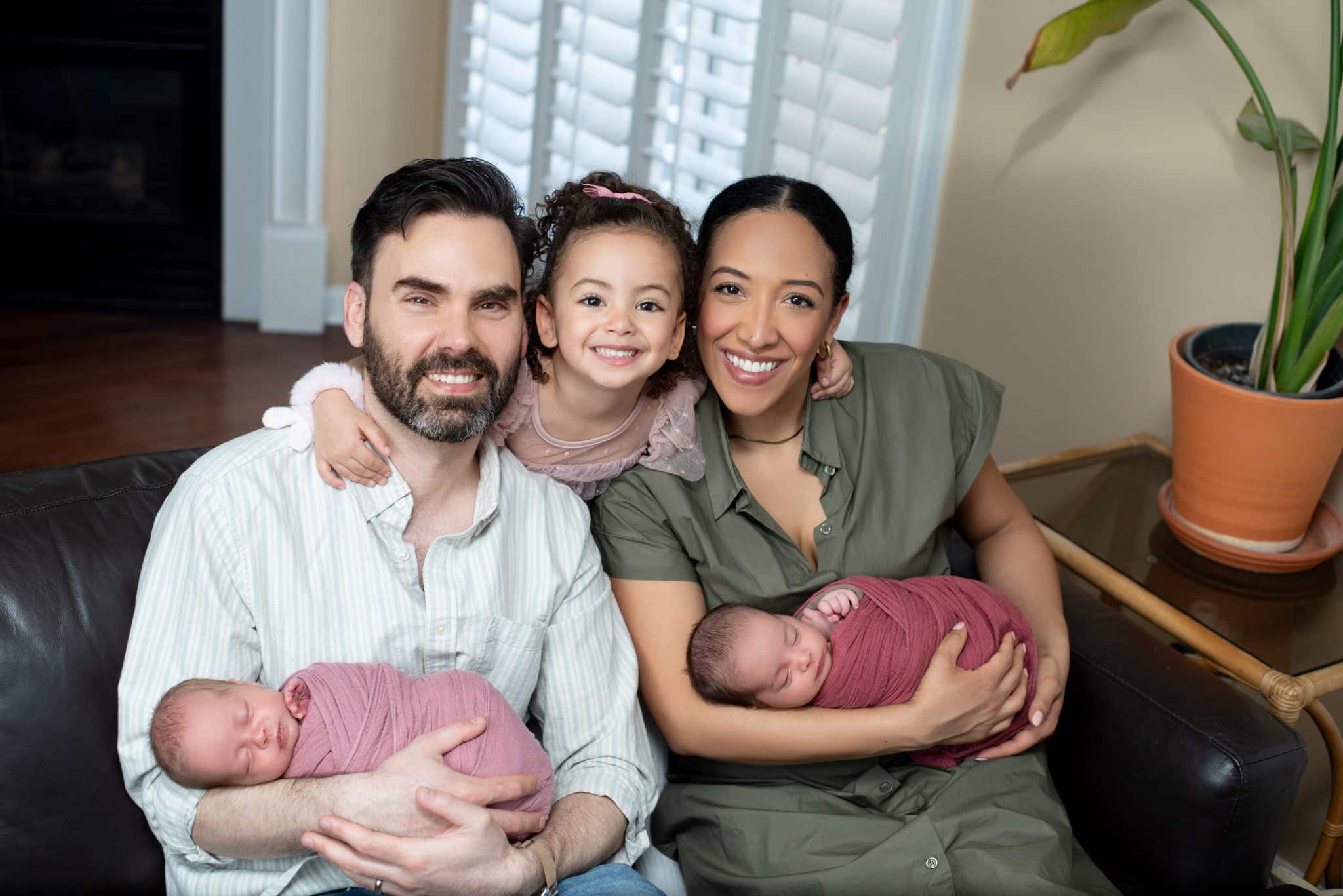Lifestyle family newborn photography Toronto session with parents and twins captured at home