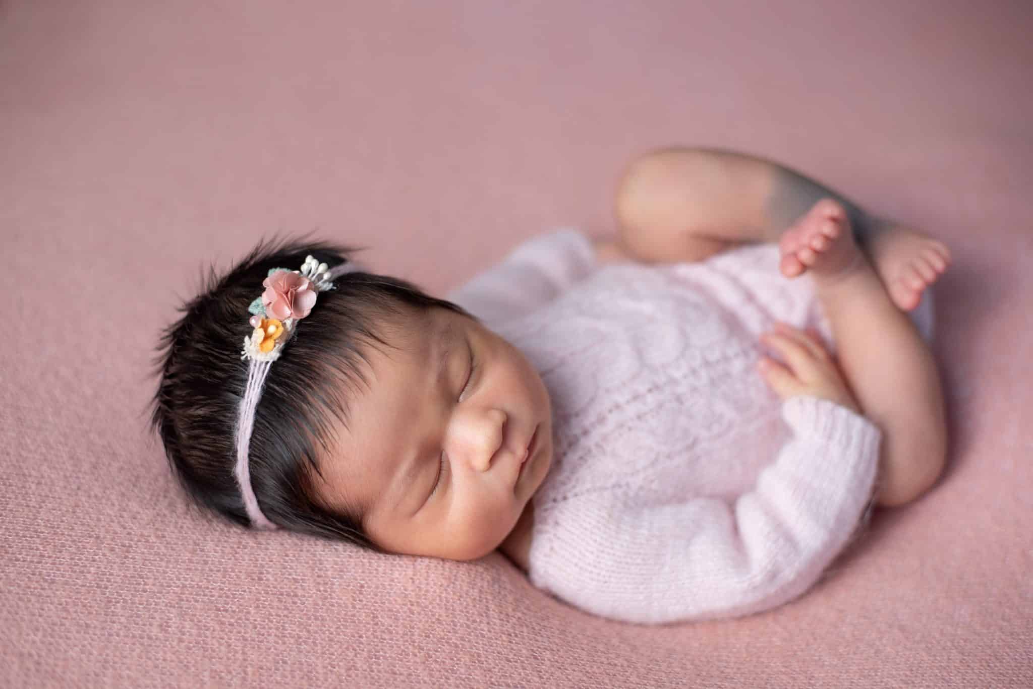 Newborn with flower crown during Mississauga newborn photography.