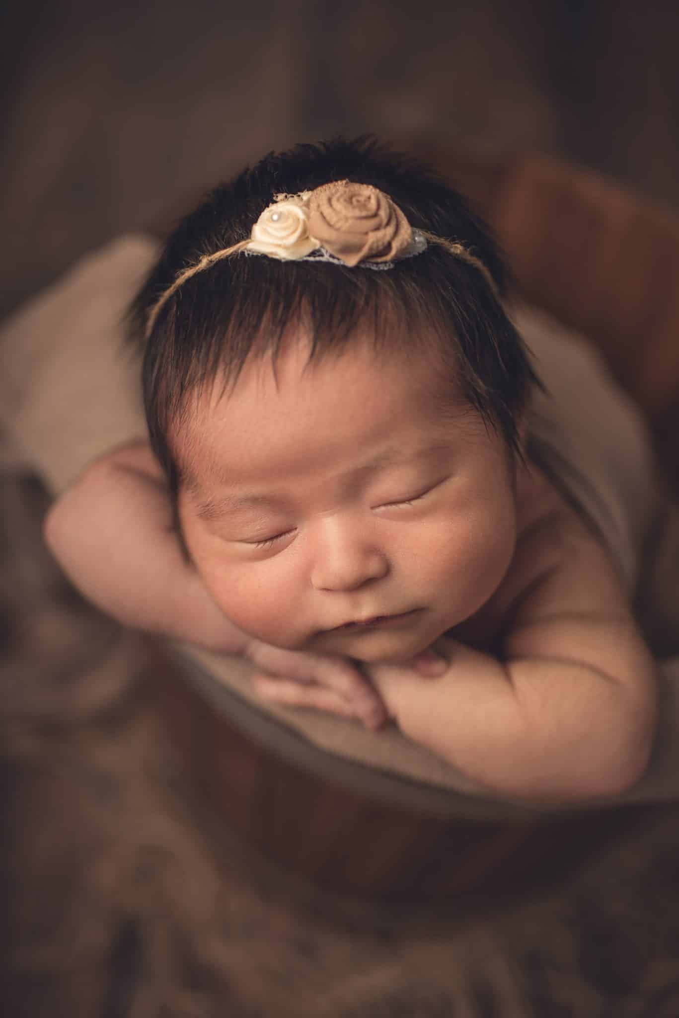 Baby photographer Toronto – close-up macro style newborn portrait with soft studio lighting